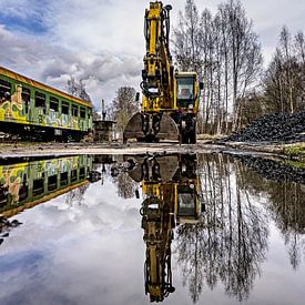 Excavator of the puddle by Johnny Flash