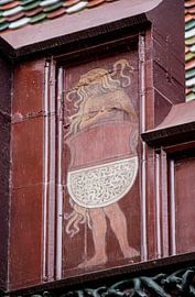 Shield with young woman on top of the roof of the Basel Town Hall in Switzerland