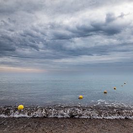 Row of buoys on the ocean against stormy sky by VIDEOMUNDUM