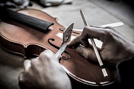 Violin maker close-up by AwesomePics