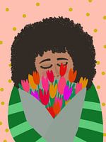 Woman smells fresh bunch of tulips
