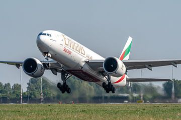 An Emirates SkyCargo Boeing 777 cargo plane takes off from the Polderbaan runway. by Jaap van den Berg