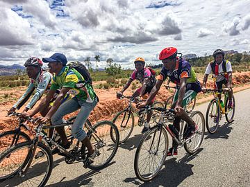Group of cyclists in training in Madagascar by Joost Leferink