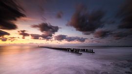 Domburg pile head sunset and moving clouds by Linda Raaphorst