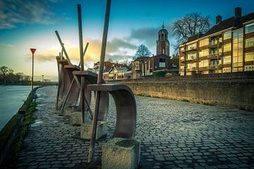 Artwork (ship) on Deventer's Welle with Deventer in the background during sunset.... by Bart Ros