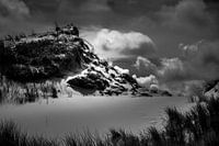 Dune with dramatic clouds