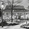 Elsloo in de avond in de winter met sneeuw in houtskool van Maurice Meerten