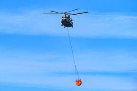 Helicopter with water bucket for wildfire fighting by Sjoerd van der Wal Photography