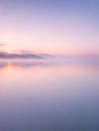 Sunrise through the mist by the lake, the magic of awakening
