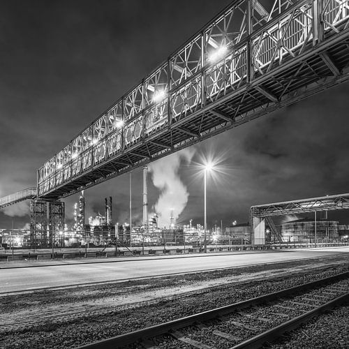Night scene with massive pipeline bridge near refinery, Antwerp