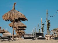 Sunbeds with parasol on a hot summer day in the Netherlands