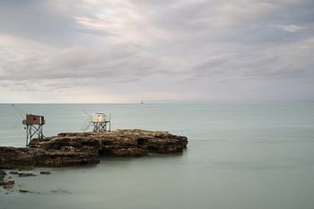 Two fishermen huts on rocks