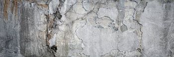Oude, gebroken betonnen muur