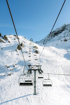 From the chairlift in the French Alps - Winter sports photo in the sun by Marit Hilarius
