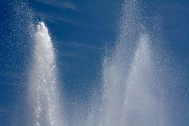 Fountain sprays in the blue sky by Judith van Wijk