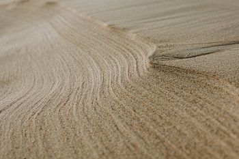 Almost abstract lines in the sand made by the wind