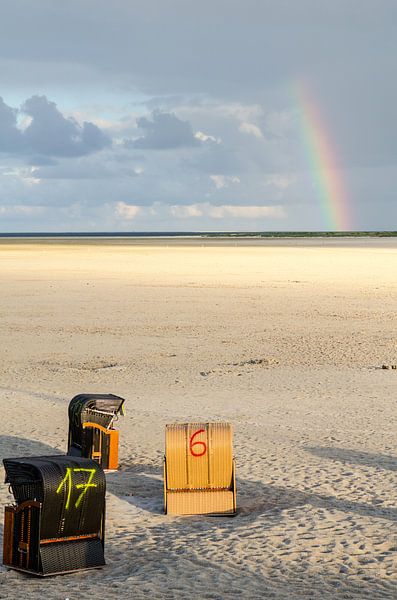 Rainbow over beach chairs on the North Sea by Alexander Baumann