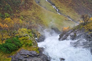 Dynamic waterfall in a rocky autumn landscape with gushing water. by Martin Köbsch