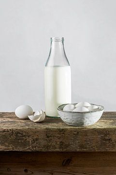 White still life bottle of milk, eggs on a bench of old oak monastery parts by Susan Chapel