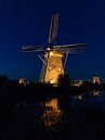 Blauwe uurtje Kinderdijk in the spotlights van Mark den Boer thumbnail