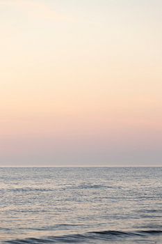 zonsondergang aan zee, pastelkleuren