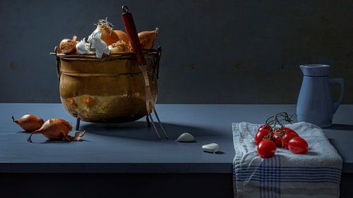 Still life of copper pot with onion and tomato