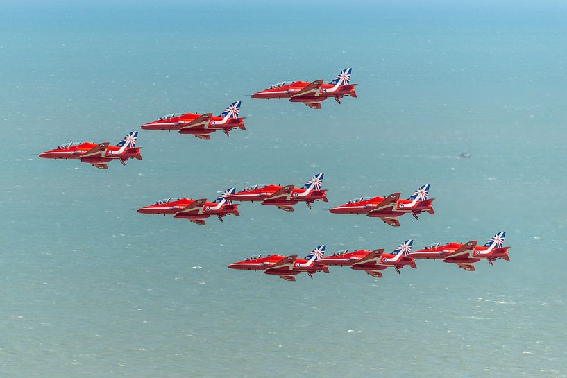 The Red Arrows' 9 BAe Hawk aircraft in action at the 2014 Eastbourne International Airshow. by Jaap van den Berg
