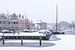 Het haventje van Woerden in de sneeuw. van John Verbruggen