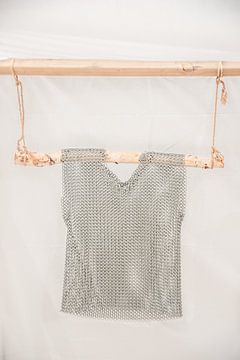 Chainmail on a wooden hanging system in pastel shades by Frans Scherpenisse