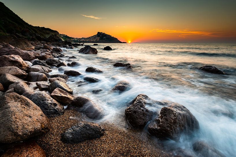Stones on the beach in Sardinia by Damien Franscoise