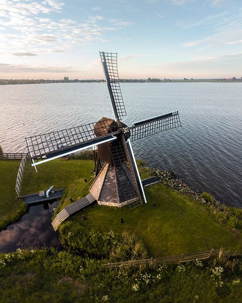 Mill on the waterfront in the Frisian landscape by Ewold Kooistra