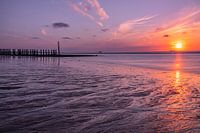 Zonsondergang met getijdenstroming in Zeeland