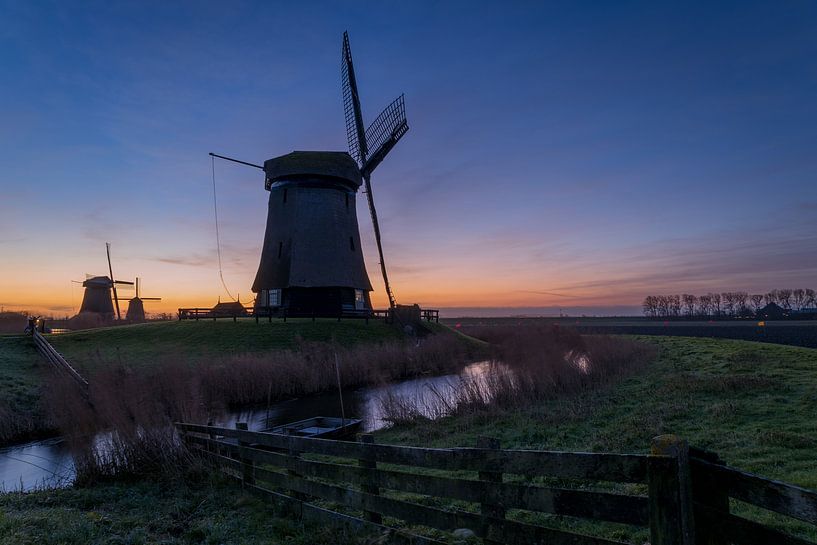 Mills of schermerhorn at sunrise by peterheinspictures