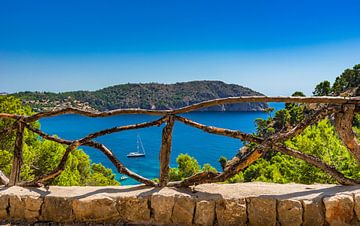 Beautiful view of idyllic bay with sailing yacht at coast of Mallorca island by Alex Winter