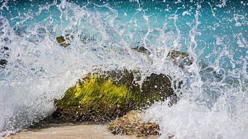 A rock in the surf by Harold van den Hurk