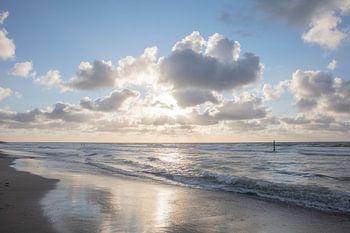 North sea beach with clouds and sunbeams