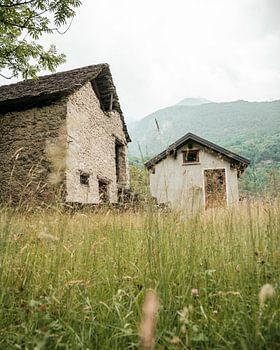 low perspective of two houses in the mountains of italy