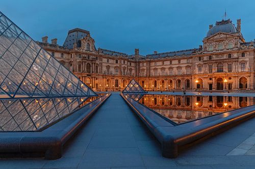 Louvre Museum reflected in the water