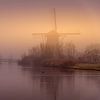 Kinderdijk Mühle im Nebel von Mark Bolijn