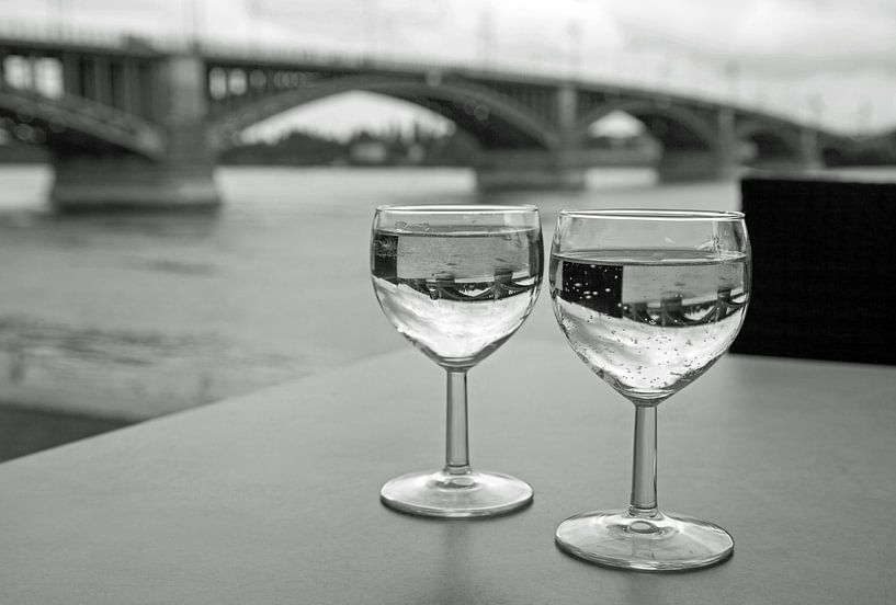 Two glasses of wine on the table by Helga Kuiper