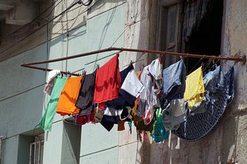 Laundry on rack by Astrid Tomeij