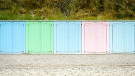 Row of brightly coloured beach houses on the coast by Fotografiecor .nl