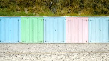 Row of brightly coloured beach houses on the coast by Fotografiecor .nl