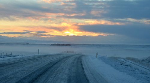 Sunrise on a deserted road.