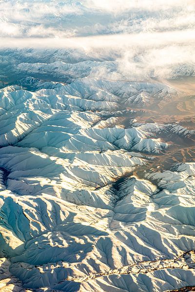 Aerial view Zagros mountains in Iran with white mountains and mist veil by Dieter Walther