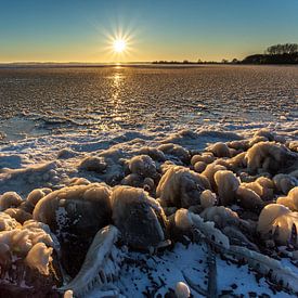 Sunrise over the frozen IJsselmeer by Miranda van Assema