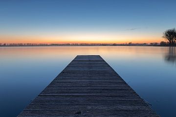 Jetty in Dirkshorn lake during blue hour by Bram Lubbers