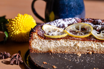 Cross-section of a lemon cheesecake with candied citrus fruit