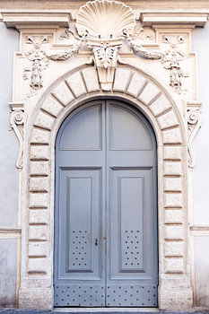 Blue/grey wooden front door in Rome