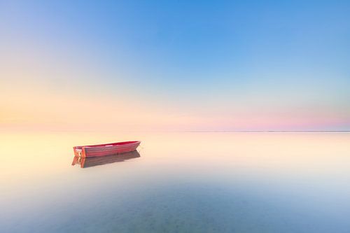 Red boat in a sea of blue/pink pastels